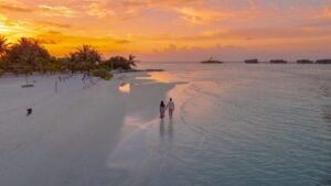 Couple enjoying the sunset in Maldives